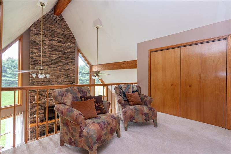 1473 Lovi Road Freedom, PA 15042 - Photo 13 of 22 The sitting room/loft overlooks the great room and enjoys full window exposure of natures scenery.