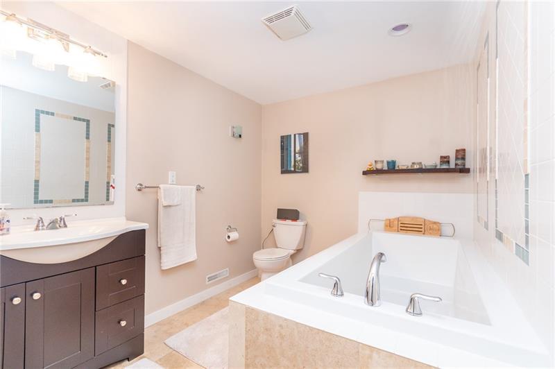 1473 Lovi Road Freedom, PA 15042 - Photo 19 of 22 A grand full bath with extra deep soaking tub is located on the lower level & is adjacent to the family room.