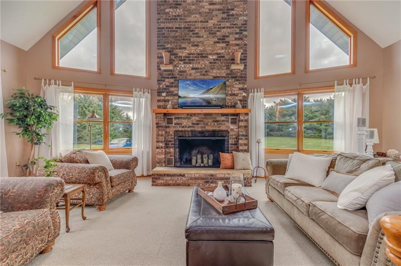 1473 Lovi Road Freedom, PA 15042 - Photo 4 of 22 The 23X14 greatroom is a masterful combination of soaring cathedral ceilings & an imposing 2 story brick fireplace with rugged stone hearth.