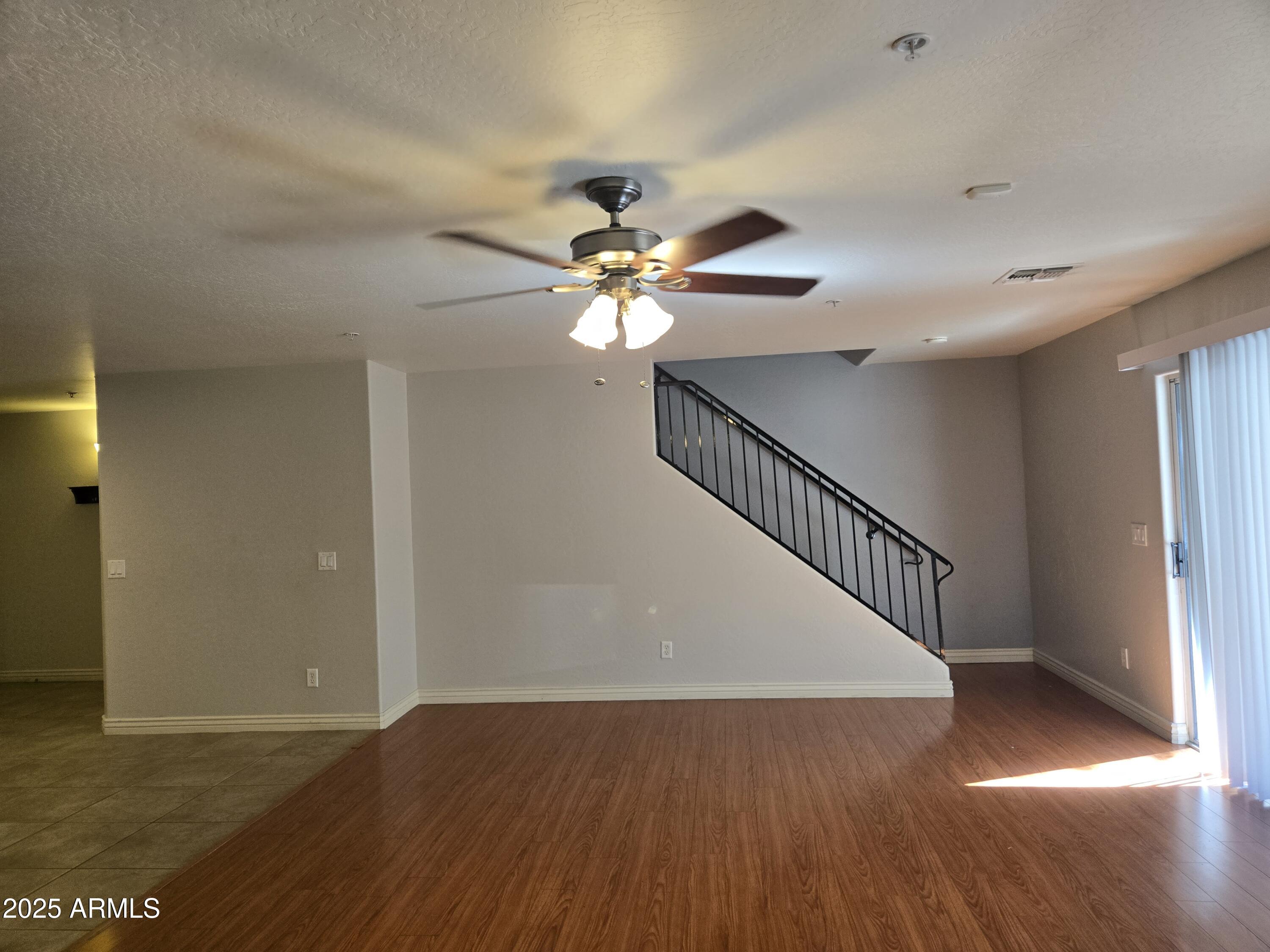 16021 North 30th Street, Unit 119 Phoenix, AZ 85032 - Photo 12 of 28 a view of entryway and hall with wooden floor
