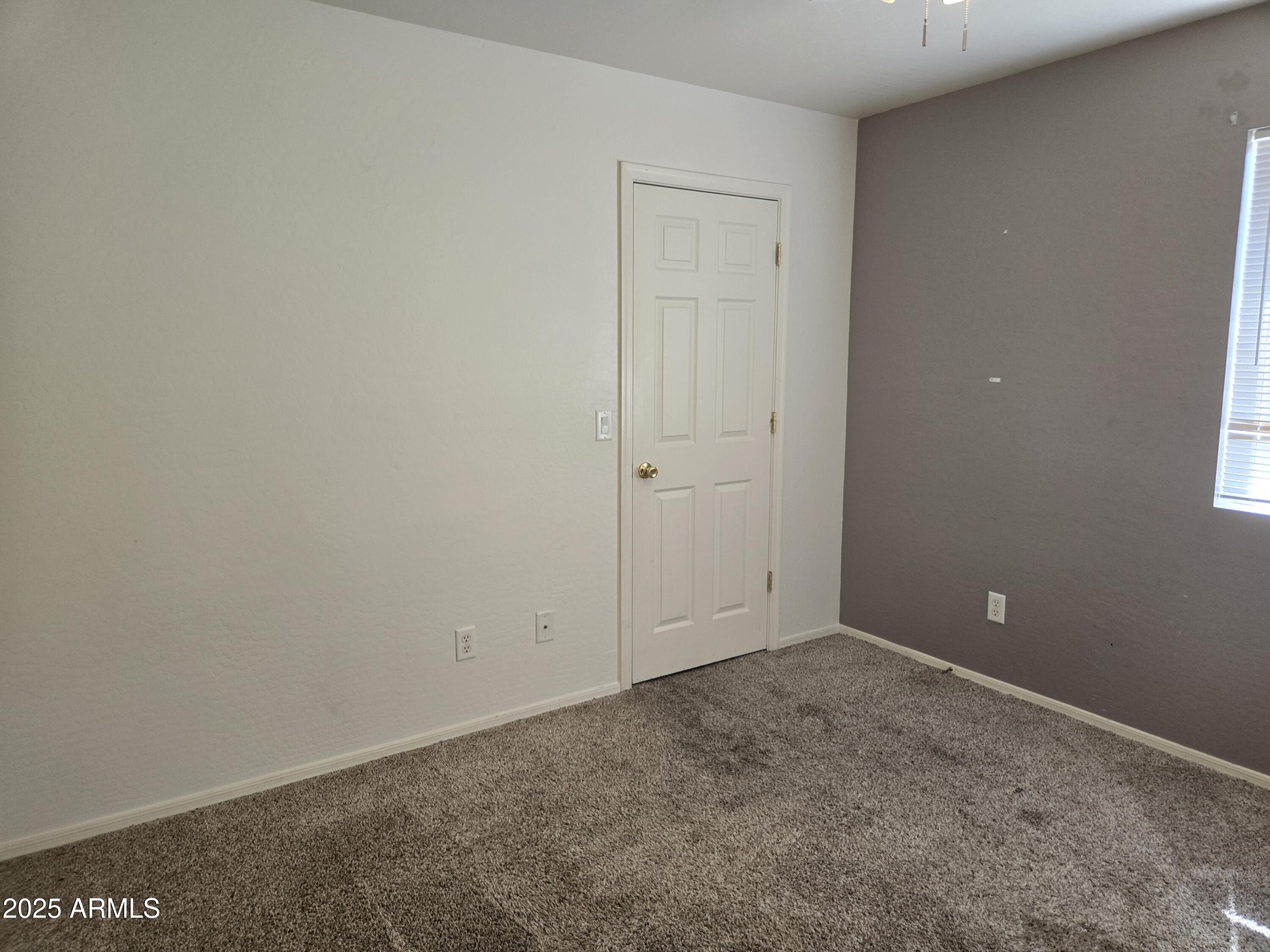 16021 North 30th Street, Unit 119 Phoenix, AZ 85032 - Photo 13 of 28 an empty room with an entryway