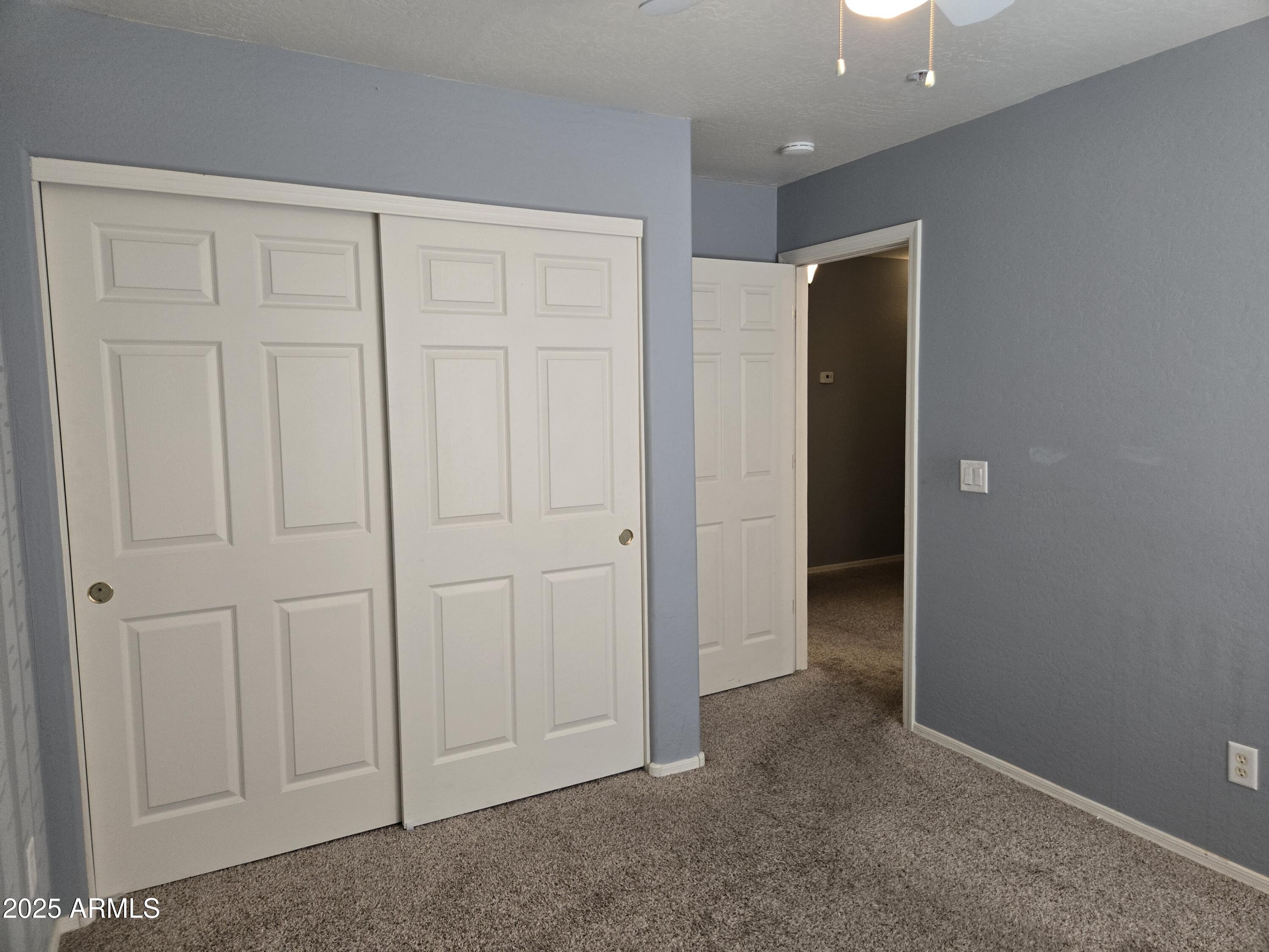 16021 North 30th Street, Unit 119 Phoenix, AZ 85032 - Photo 16 of 28 an empty room with closet area