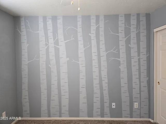 a view of a bathroom with shower curtain