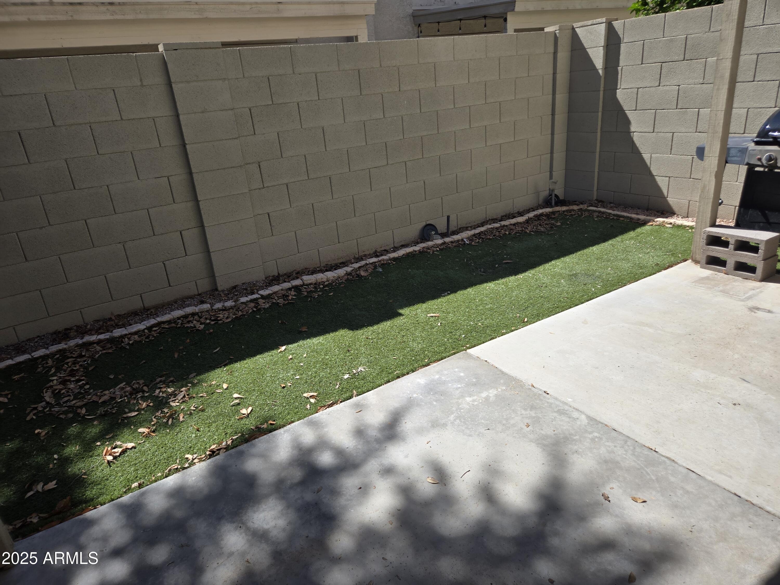 16021 North 30th Street, Unit 119 Phoenix, AZ 85032 - Photo 26 of 28 a backyard of a house