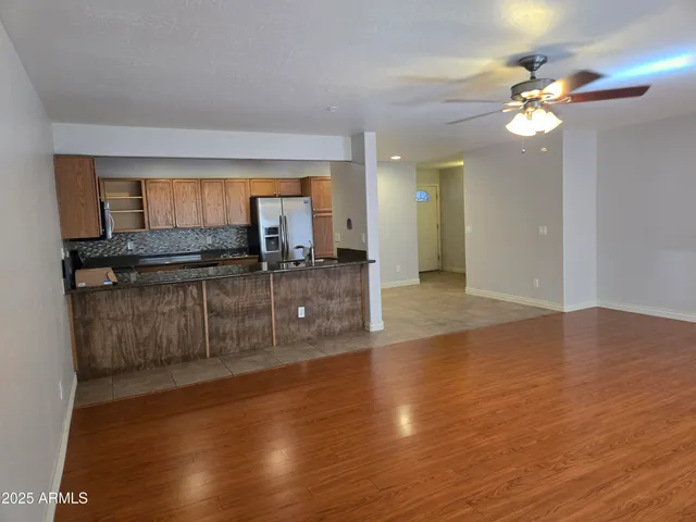 a view of a kitchen counter top space and wooden floor