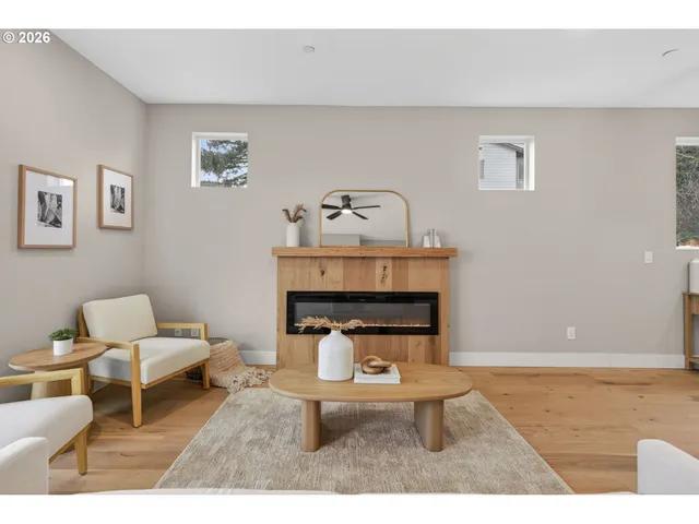 a living room with furniture and kitchen view