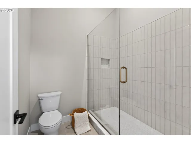 a view of a room with wooden floor and furniture
