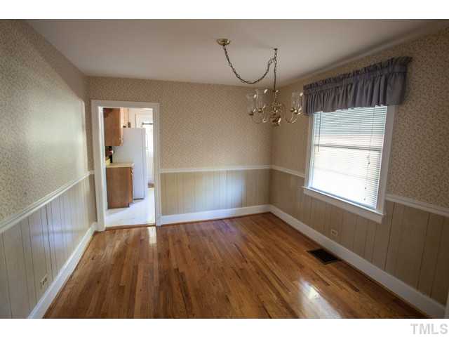448 Erwin Road Durham, NC 27707 - Photo 7 of 25 Dining room with wood floors and access to the kitchen.