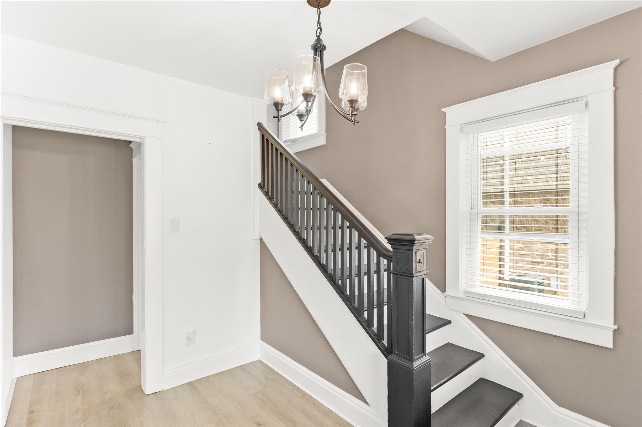 310 Hanover Road York, PA 17408 - Photo 7 of 56 a view of a hallway with windows and chandelier