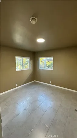 a view of an empty room and a window