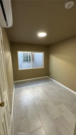 a view of an empty room and a window