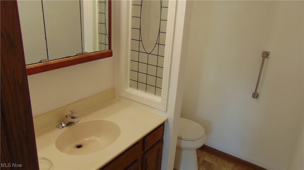 4970 Bryenton Road Litchfield, OH 44253 - Photo 15 of 33 Bathroom with vanity and toilet