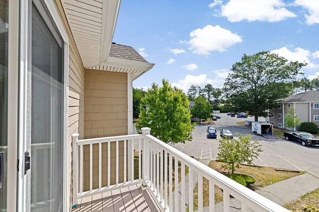 a view of a balcony with chairs