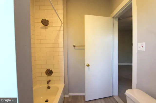 a bathroom with a tub and shower