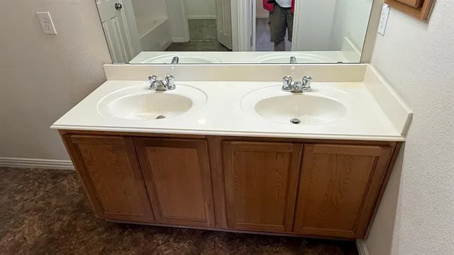 a bathroom with a sink and a mirror