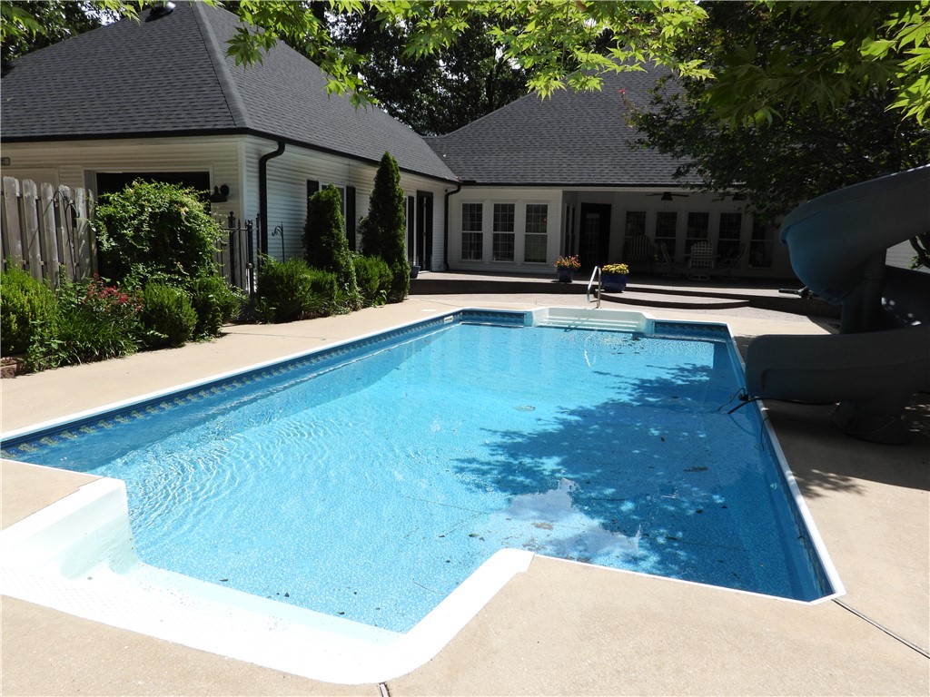 19489 Oak Circle Springdale, AR 72764 - Photo 32 of 58 In-ground swimming pool with concrete surround
