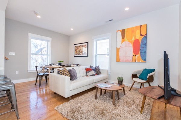 39 Montrose Street, Unit 2 Everett, MA 02149 - Photo 1 of 12 a living room with furniture a rug and a window