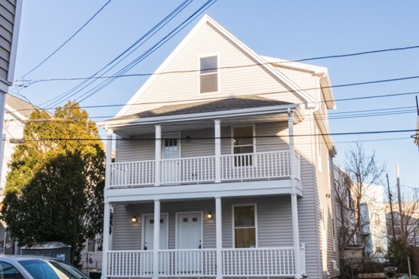 39 Montrose Street, Unit 2 Everett, MA 02149 - Photo 11 of 12 a front view of a house with a garage