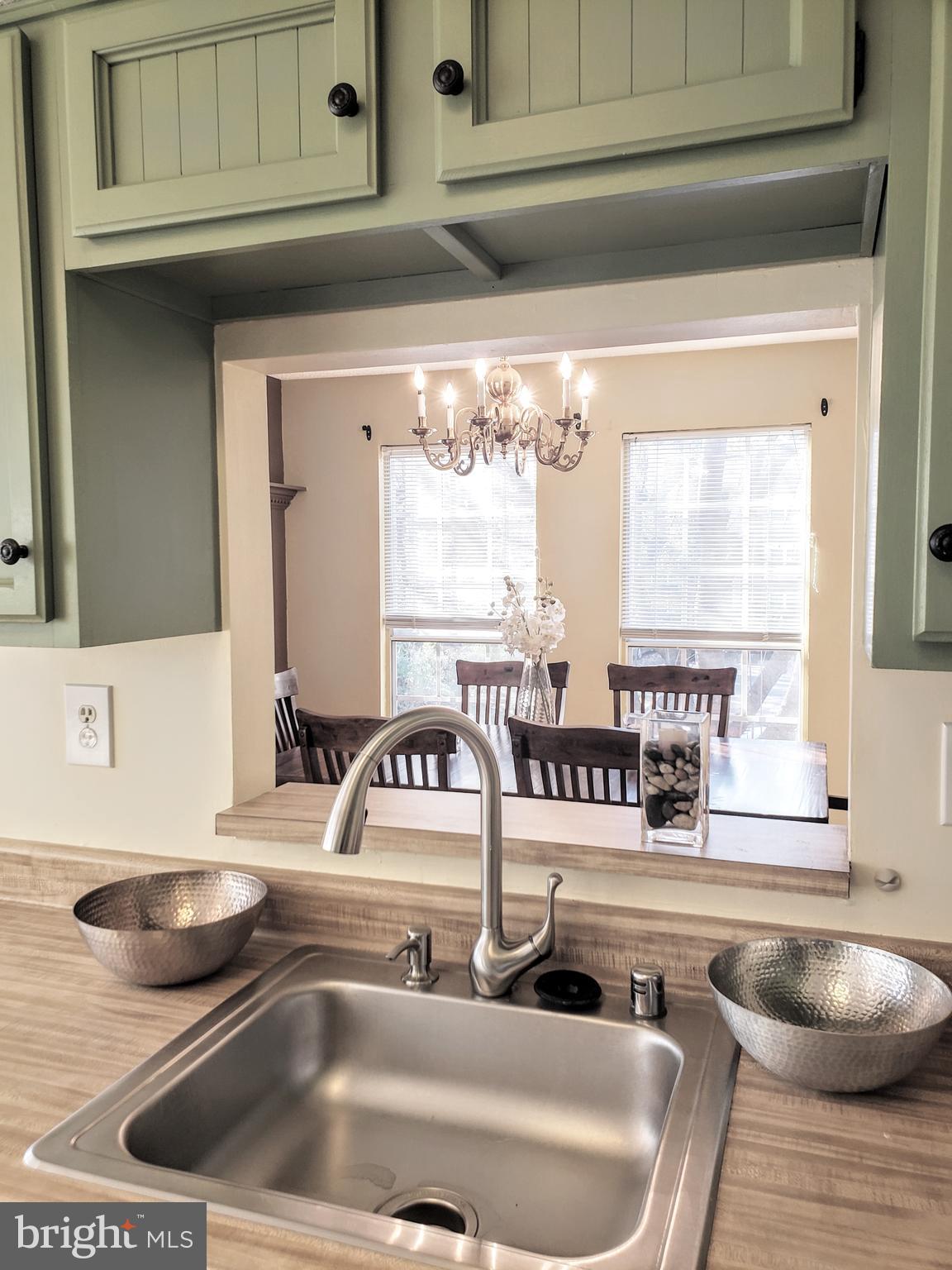 11343 Baroque Road Silver Spring, MD 20901 - Photo 13 of 43 From sink looking through cutout to dining room