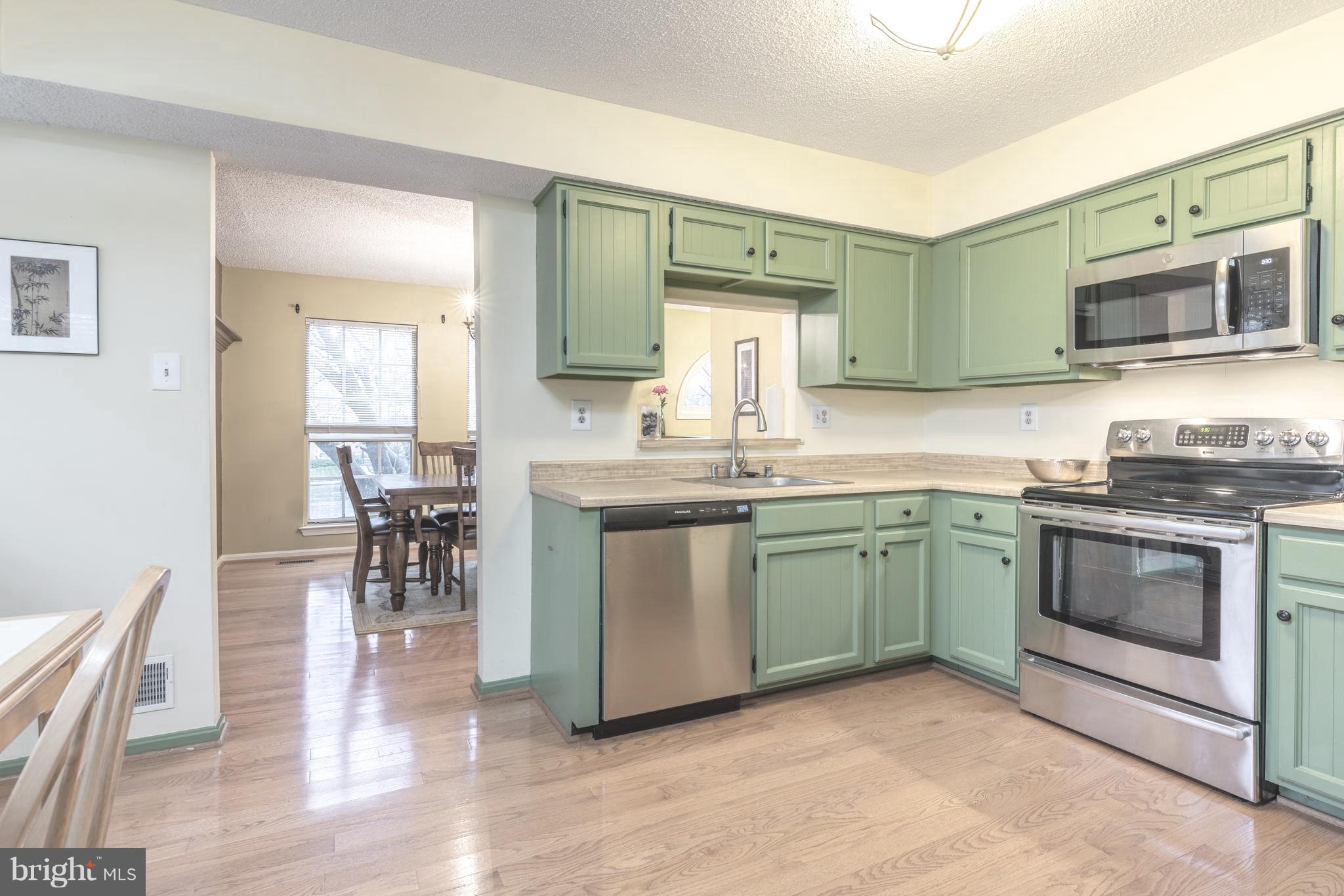 11343 Baroque Road Silver Spring, MD 20901 - Photo 8 of 43 Large kitchen opens to dining room + living room