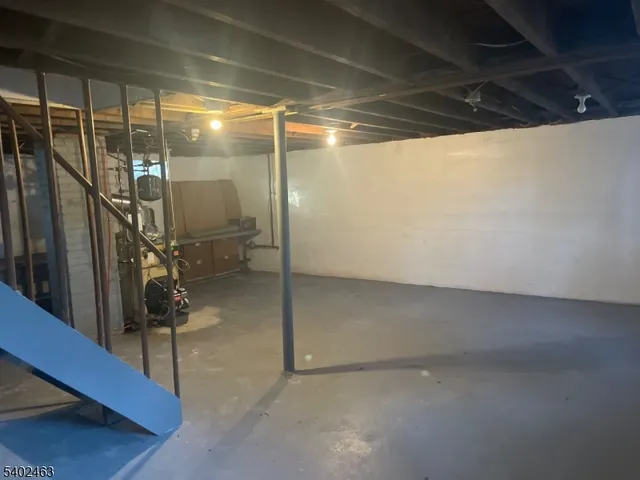 a view of a livingroom with furniture window and wooden floor