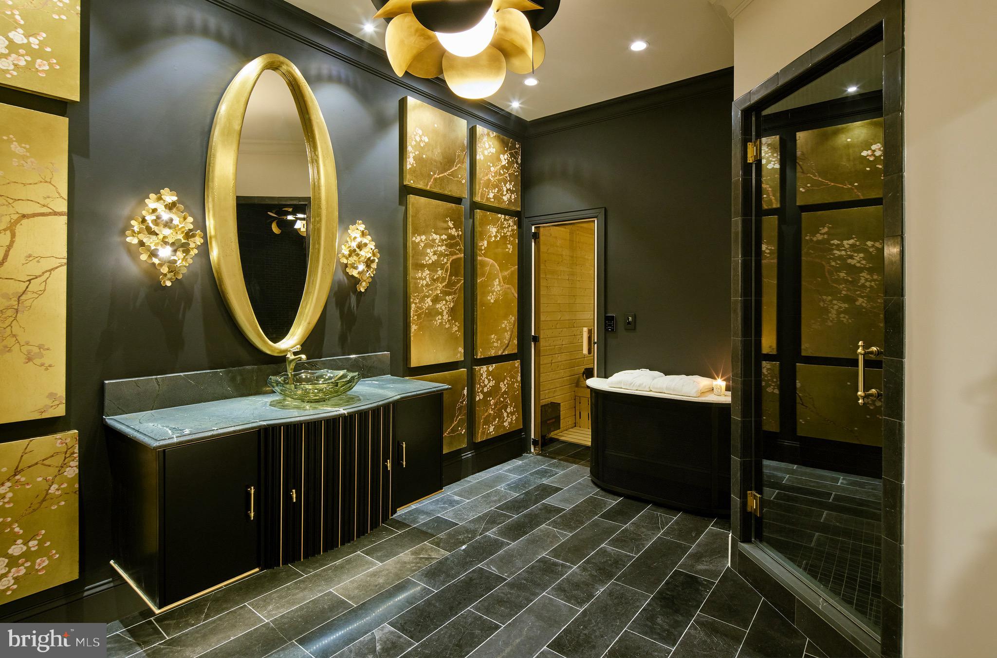 6431 Georgetown Pike McLean, VA 22101 - Photo 42 of 57 a bathroom with a sink mirror and a shower