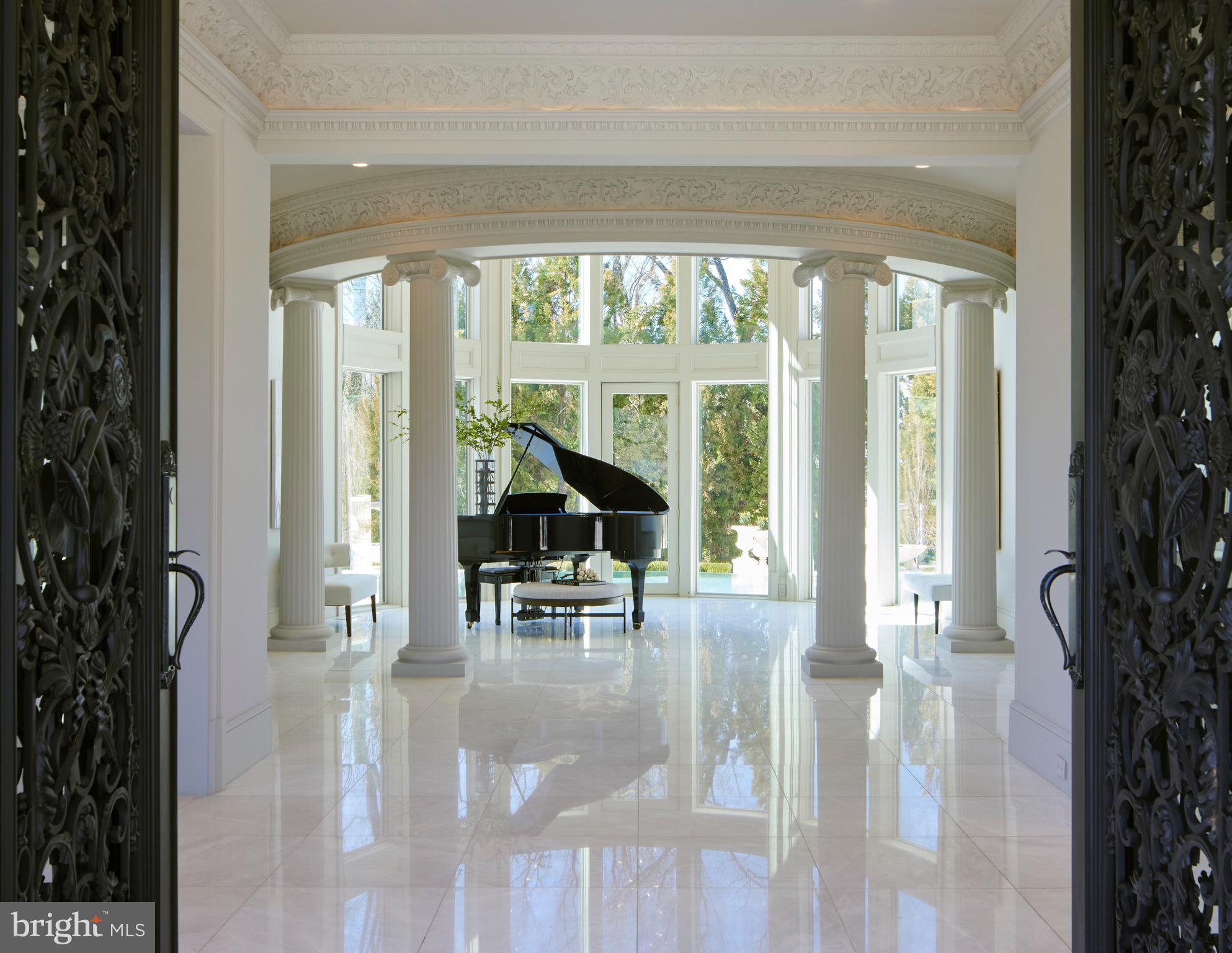 6431 Georgetown Pike McLean, VA 22101 - Photo 6 of 57 a living room filled with furniture and large windows