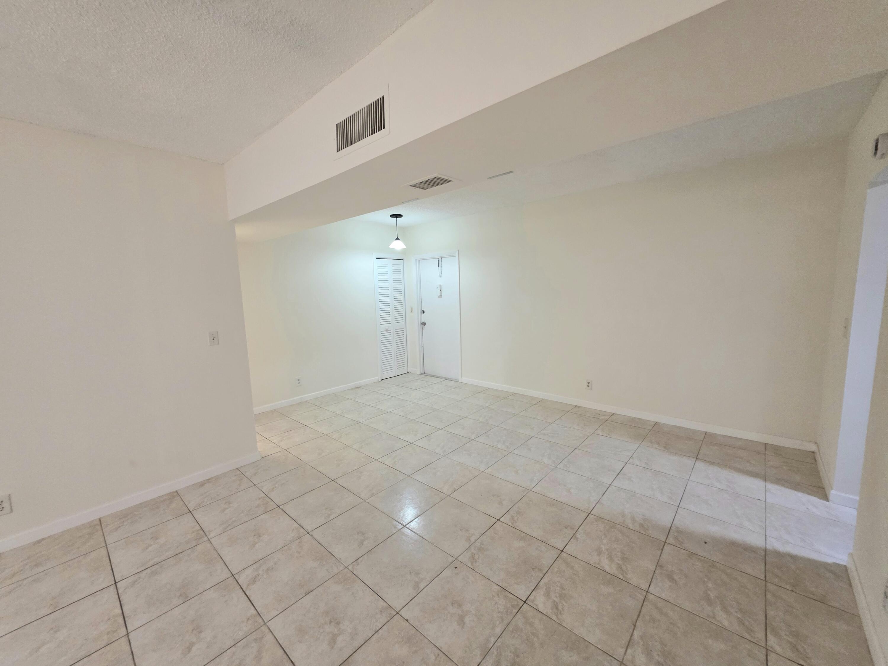683 Northwest 13th Street, Unit 27 Boca Raton, FL 33486 - Photo 7 of 16 a view of an empty room