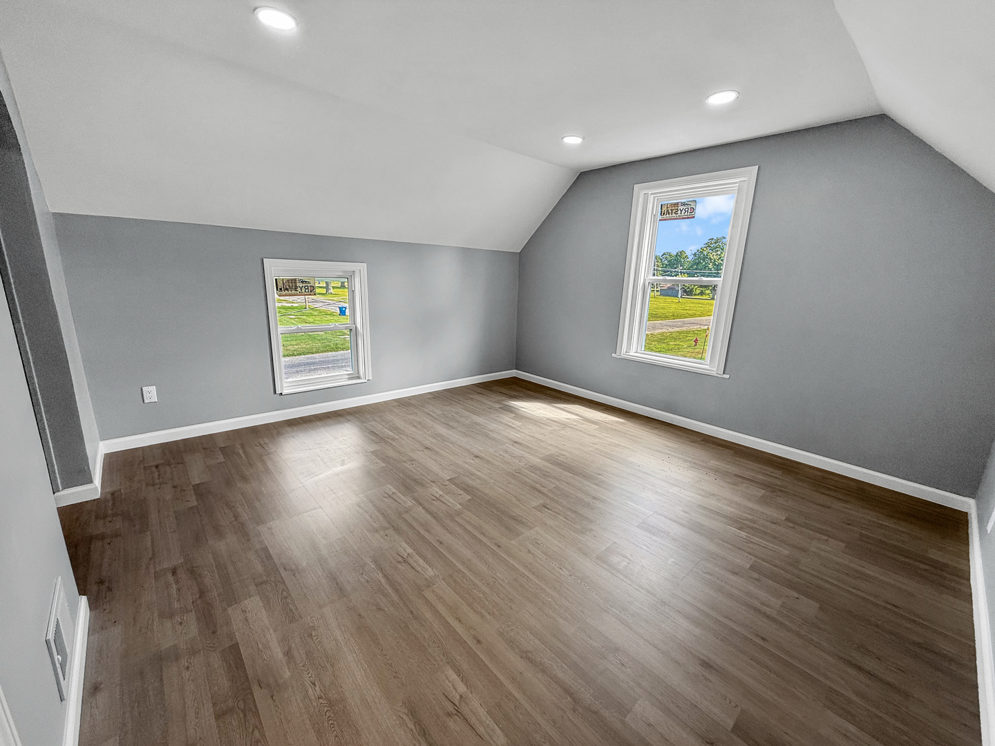 302 West Cook Street Sheffield, IL 61361 - Photo 14 of 18 an empty room with window and wooden floor