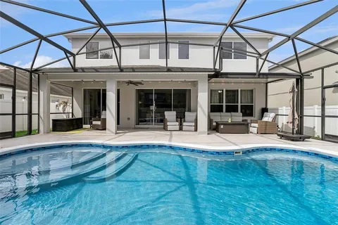 a view of a swimming pool with a patio