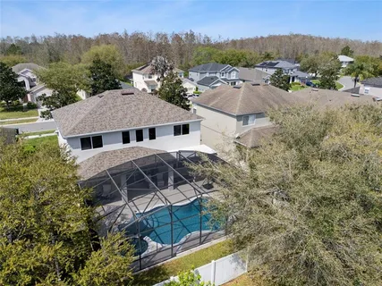 an aerial view of multiple houses with yard