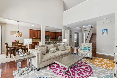 a living room with furniture and a rug