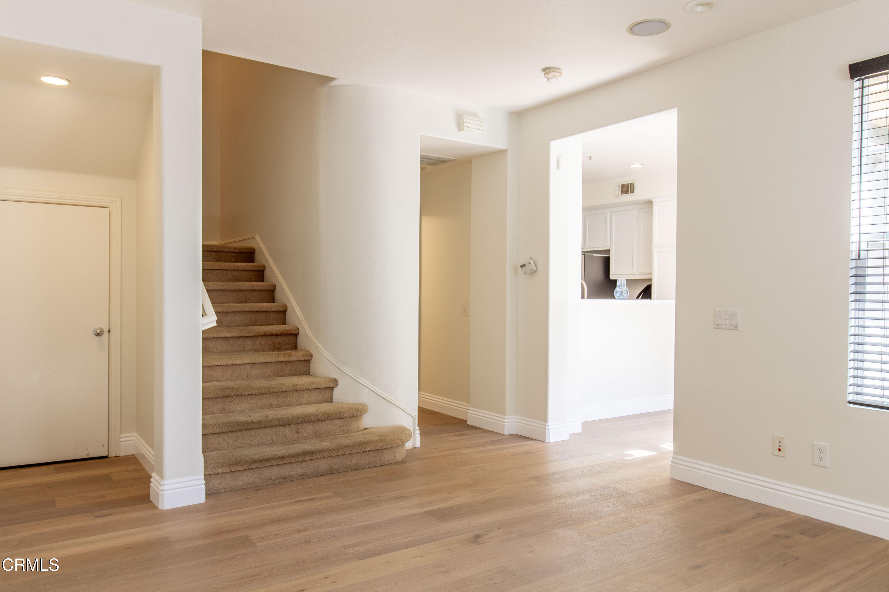 37 St Mays Road Ladera Ranch, CA 92694 - Photo 14 of 27 a view of a hallway with wooden floor and entryway