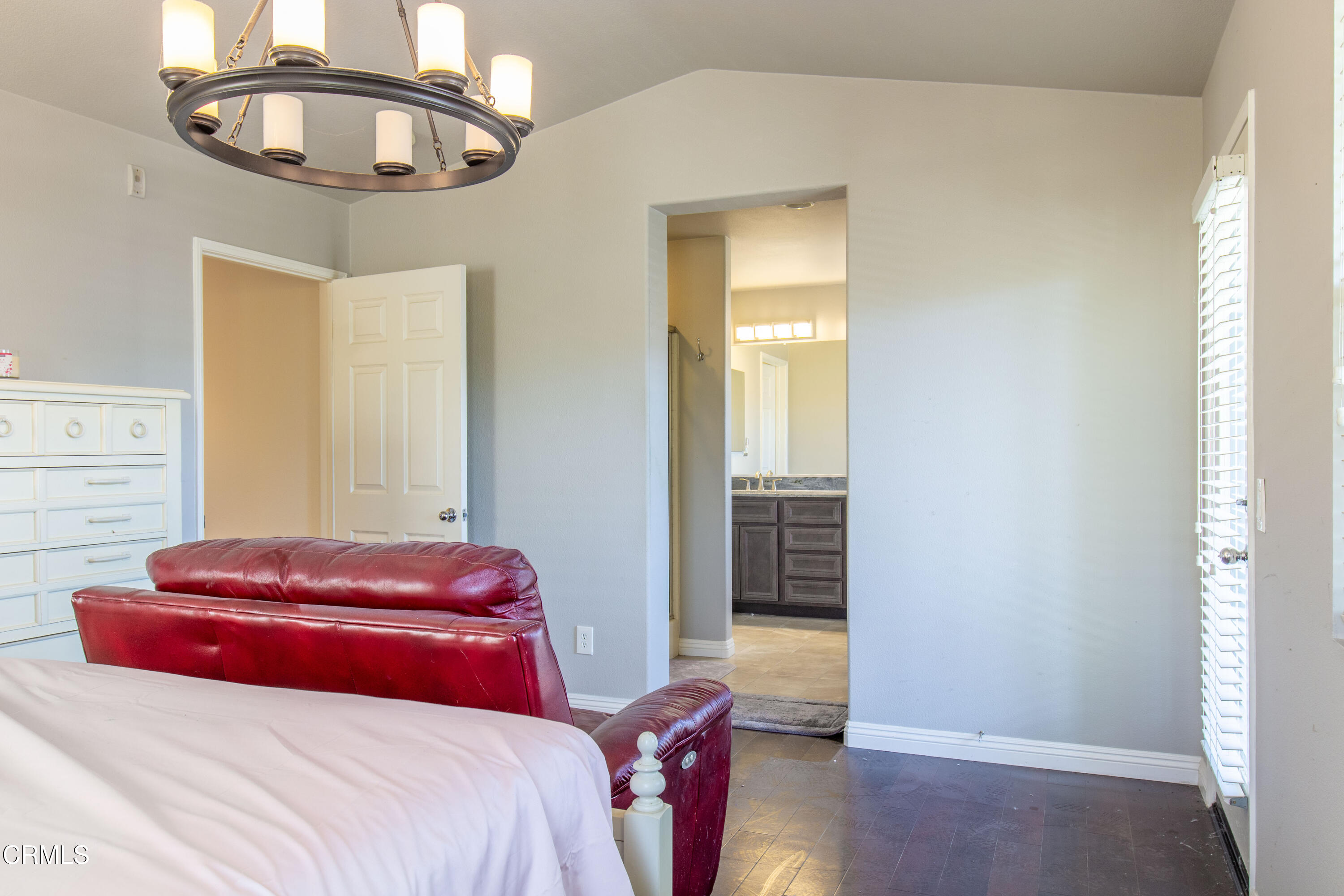 37 St Mays Road Ladera Ranch, CA 92694 - Photo 22 of 27 a bedroom with a bed a chandelier and a window