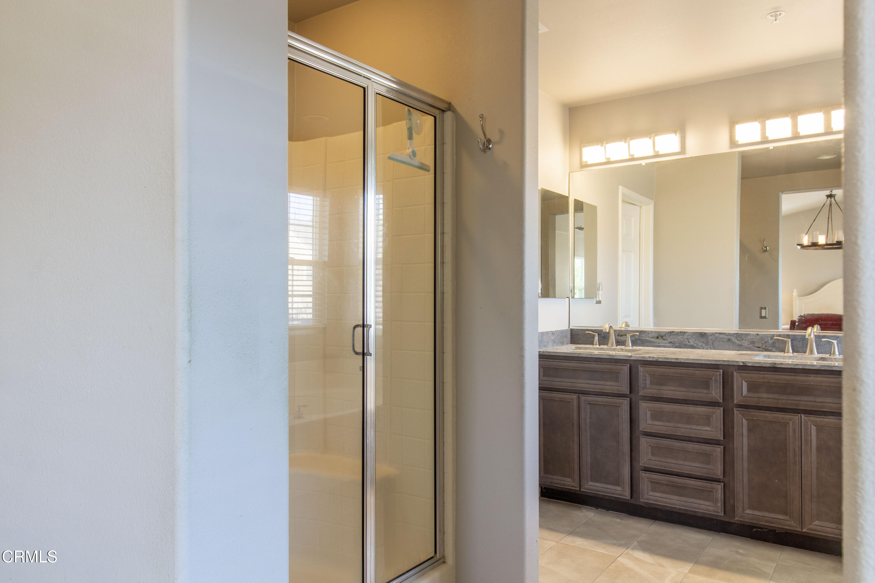 37 St Mays Road Ladera Ranch, CA 92694 - Photo 23 of 27 a bathroom with a double vanity sink and a mirror