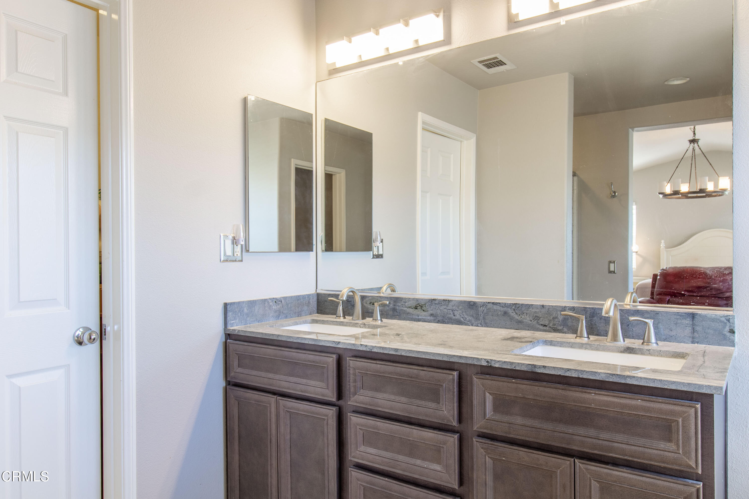 37 St Mays Road Ladera Ranch, CA 92694 - Photo 25 of 27 a bathroom with a sink and a mirror