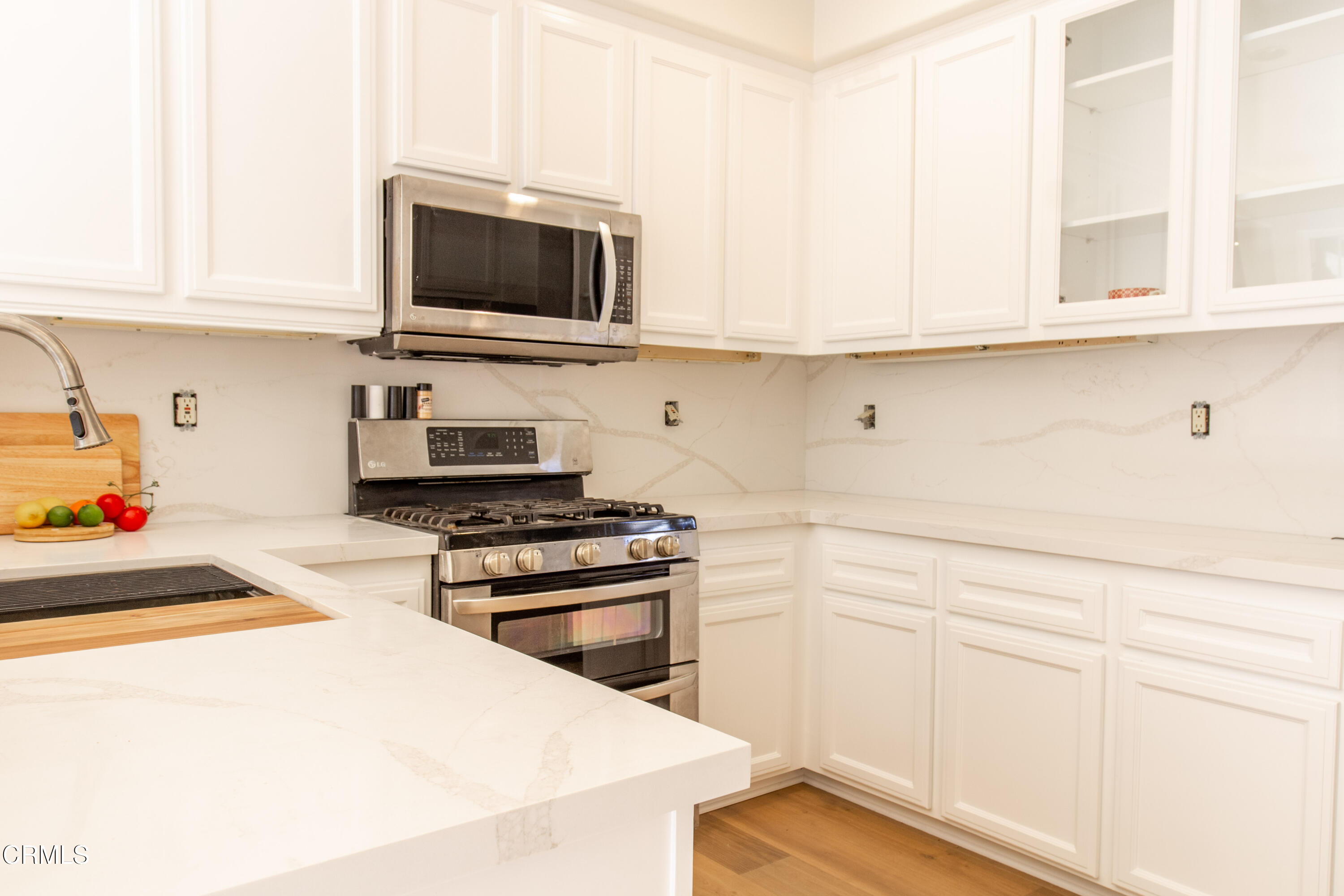 37 St Mays Road Ladera Ranch, CA 92694 - Photo 7 of 27 a kitchen with white cabinets and appliances