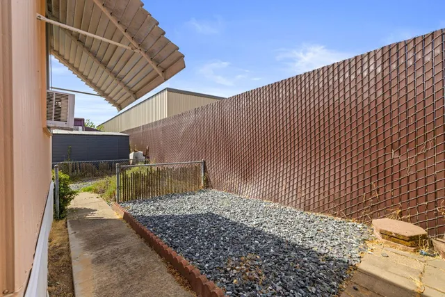 an aerial view of residential house with outdoor space and parking
