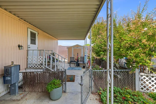 a view of a chair and table in the balcony