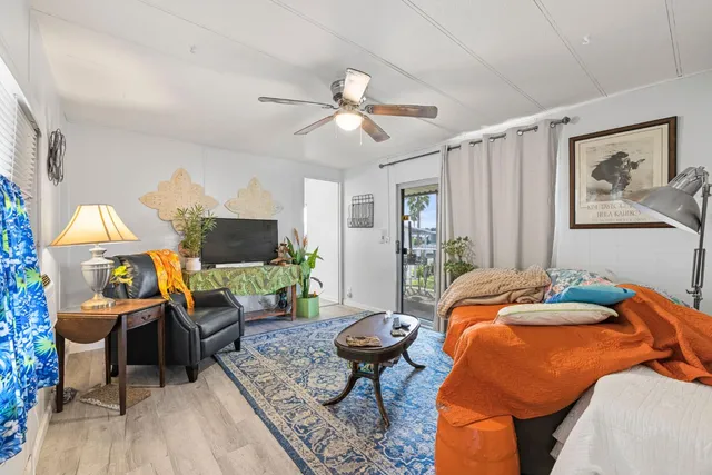 a bedroom with furniture and a fireplace