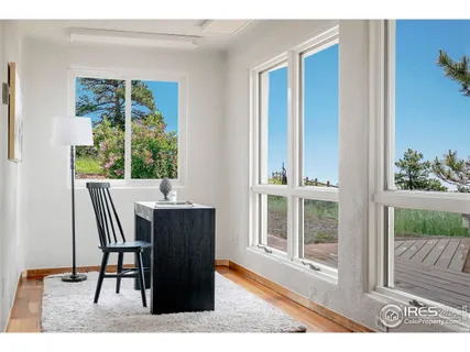 a bedroom with a bed window and couch