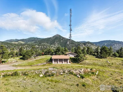 a view of a town with mountains in the background