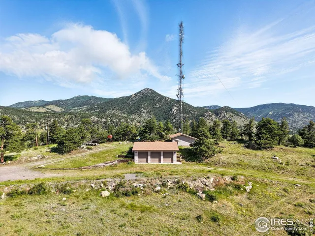 a view of a town with mountains in the background