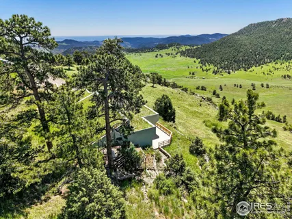 a view of a house with a flower garden