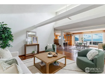 a bedroom with a large bed and a large window