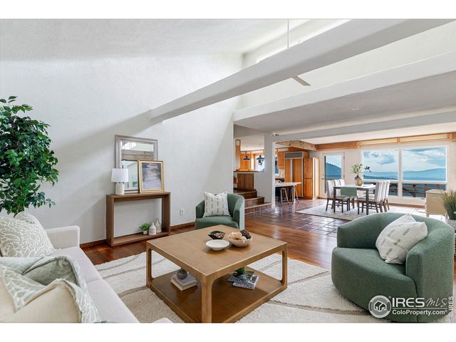 a bedroom with a large bed and a large window