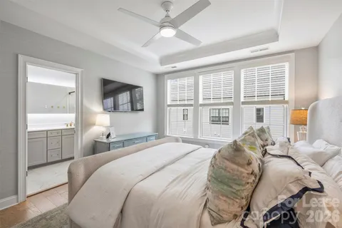 a bathroom with a sink and a mirror a shower