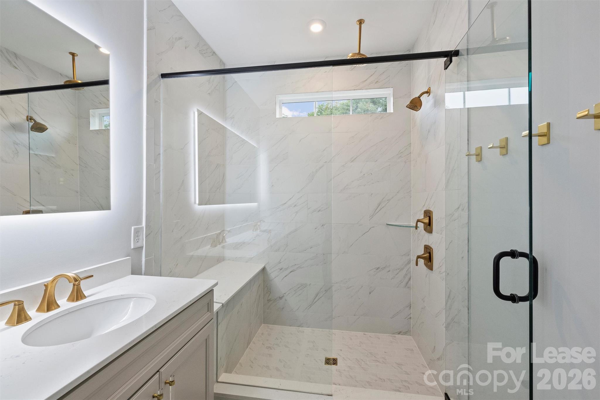 5038 Harrowsmith Lane Charlotte, NC 28204 - Photo 26 of 33 a bathroom with a shower and a sink