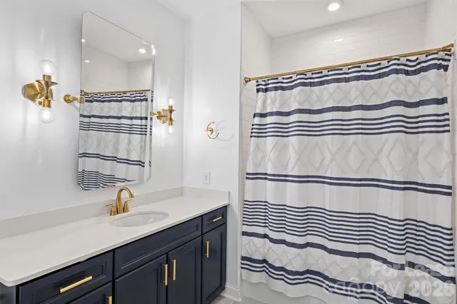 a view of a livingroom with workspace and a window
