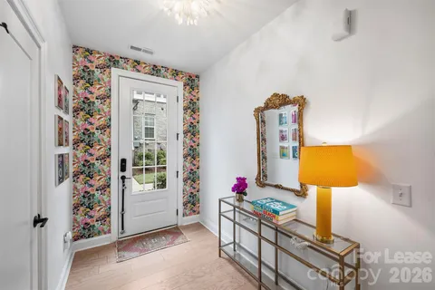 a view of a dining room with furniture and a window
